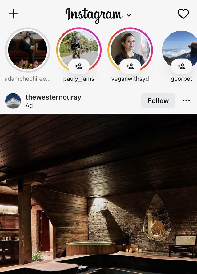 Screenshot of the Instagram application with an ad as the first post and then the stories at the top being a number of unknown accounts with add follower icon